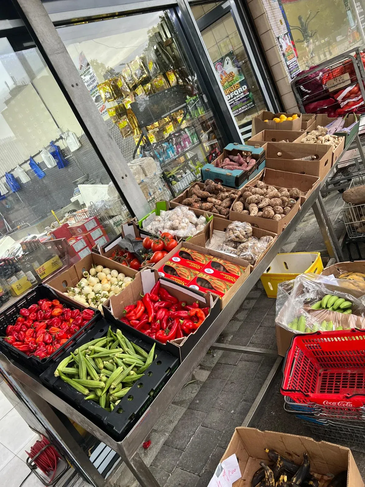 Our actual fresh produce display with okra, peppers, tomatoes, yams and plantains